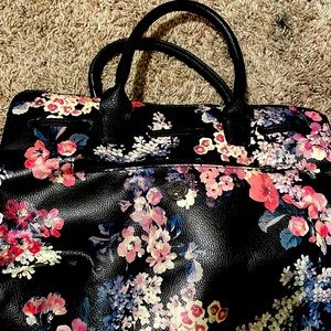 Floral rose patterned medium sized hand bag with extra shoulder strap inside